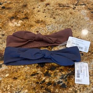 NWT Bundle Athleta swept up headbands. Blue and mauve colors.
